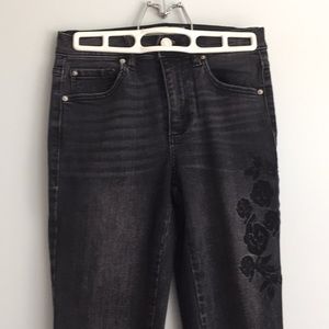 black washed out jeans+ floral stitching.